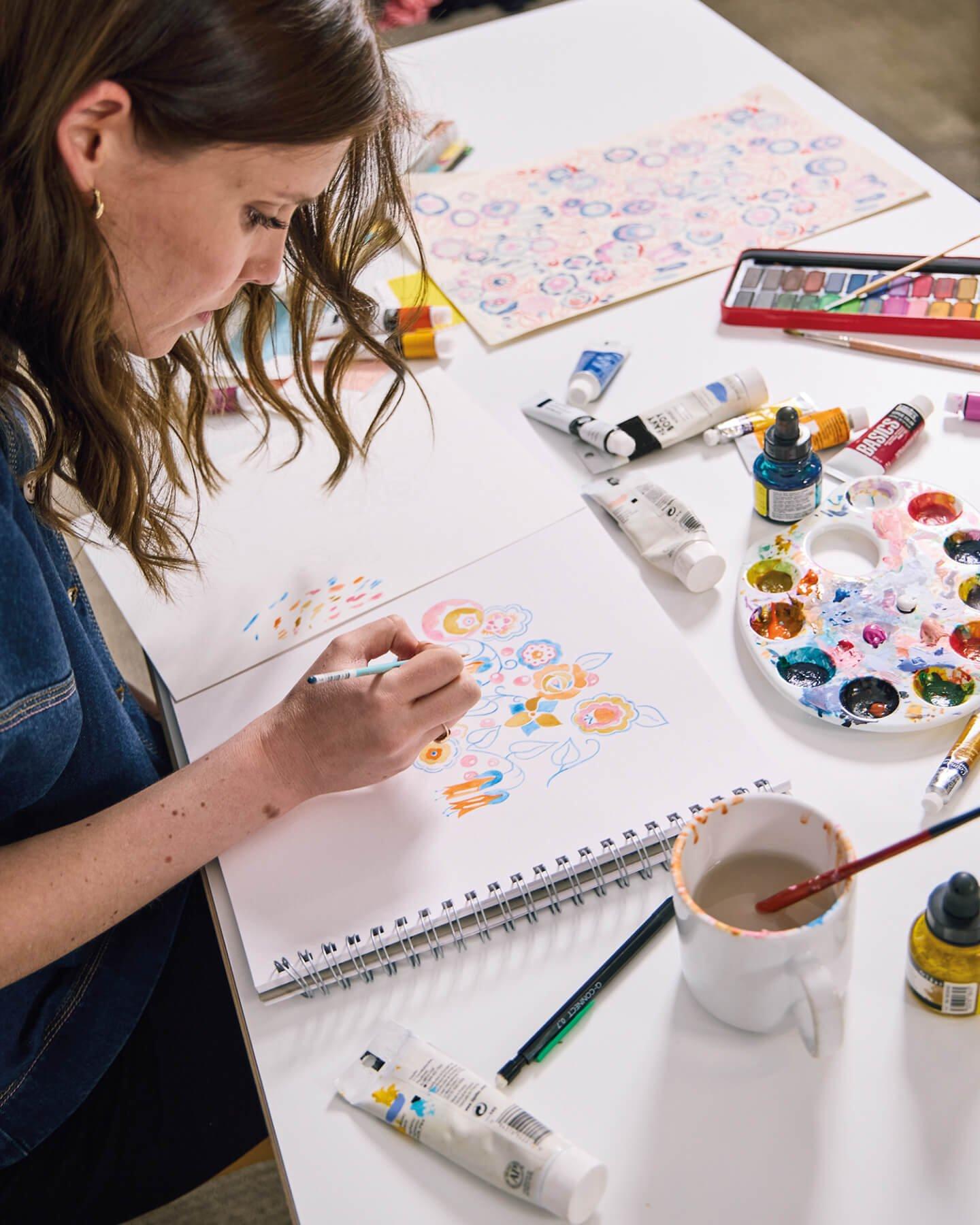 Woman drawing a fashion design